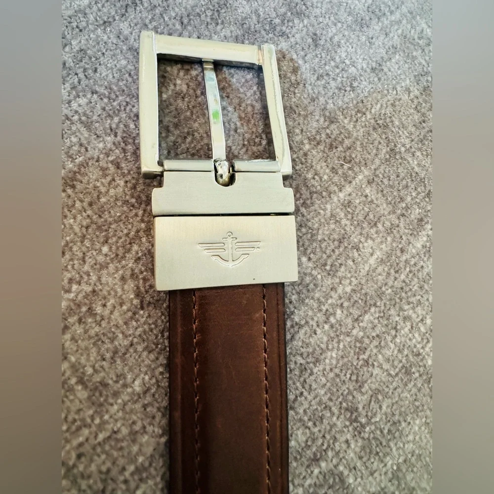 A set of two boys belts: Dockers (size 22-24) and Nautica (size 28).
